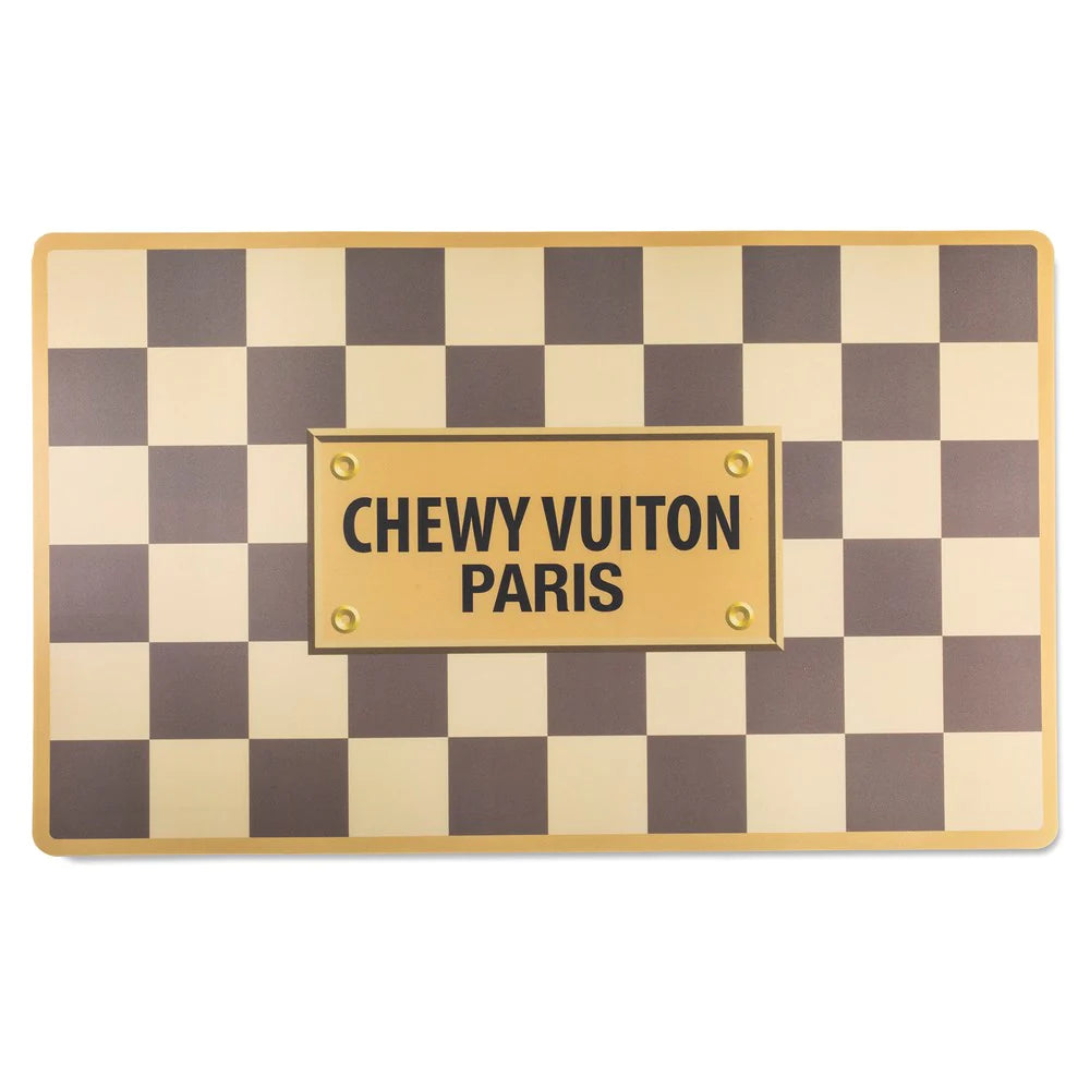 The iconic checkered style placemat adds elegance and class to your pooch’s dining experience, all while keeping everything meal-related where it should be (and not all over the floor!). Complete the haute cuisine experience the matching Chewy Vuiton Dog Bowls!