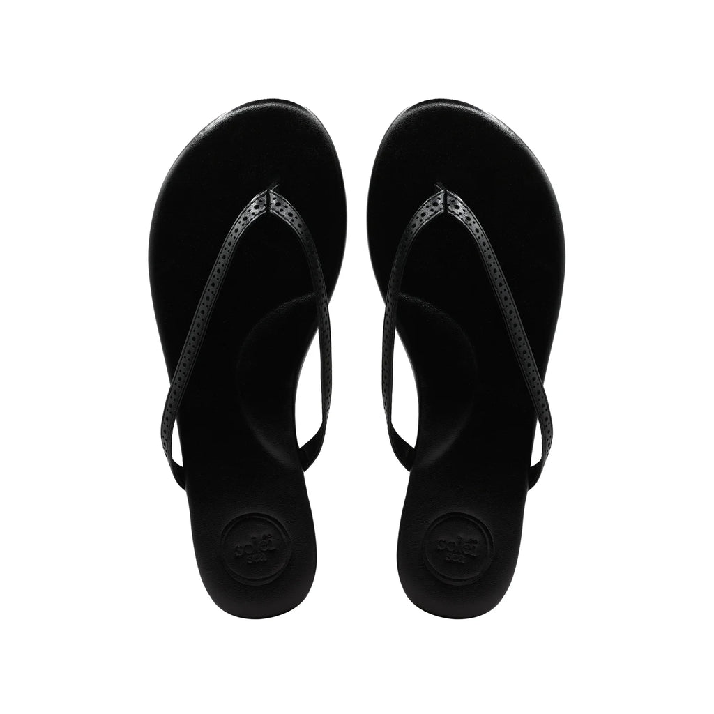 Solei Sea Indie UES Sandal Black. The cushioned footbed, padded arch support, non-slip rubber bottoms and water-resistant vegan leather pack these sandals with the versatility to seamlessly wear to the beach, brunch or anywhere in between.