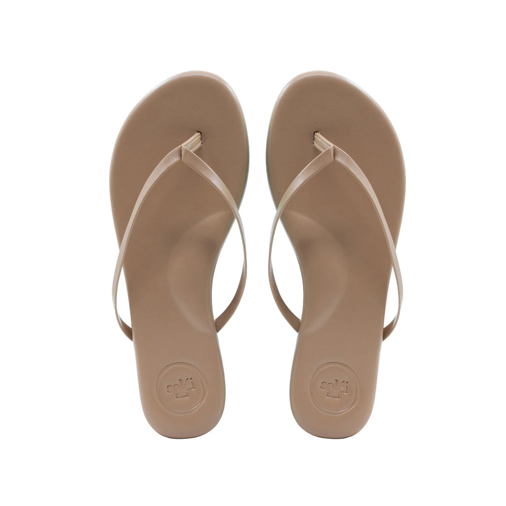 Solei Sea Indie Classic Sandal Nude. The cushioned footbed, padded arch support, non-slip rubber bottoms and water-resistant vegan leather pack these sandals with the versatility to seamlessly wear to the beach, brunch or anywhere in between.