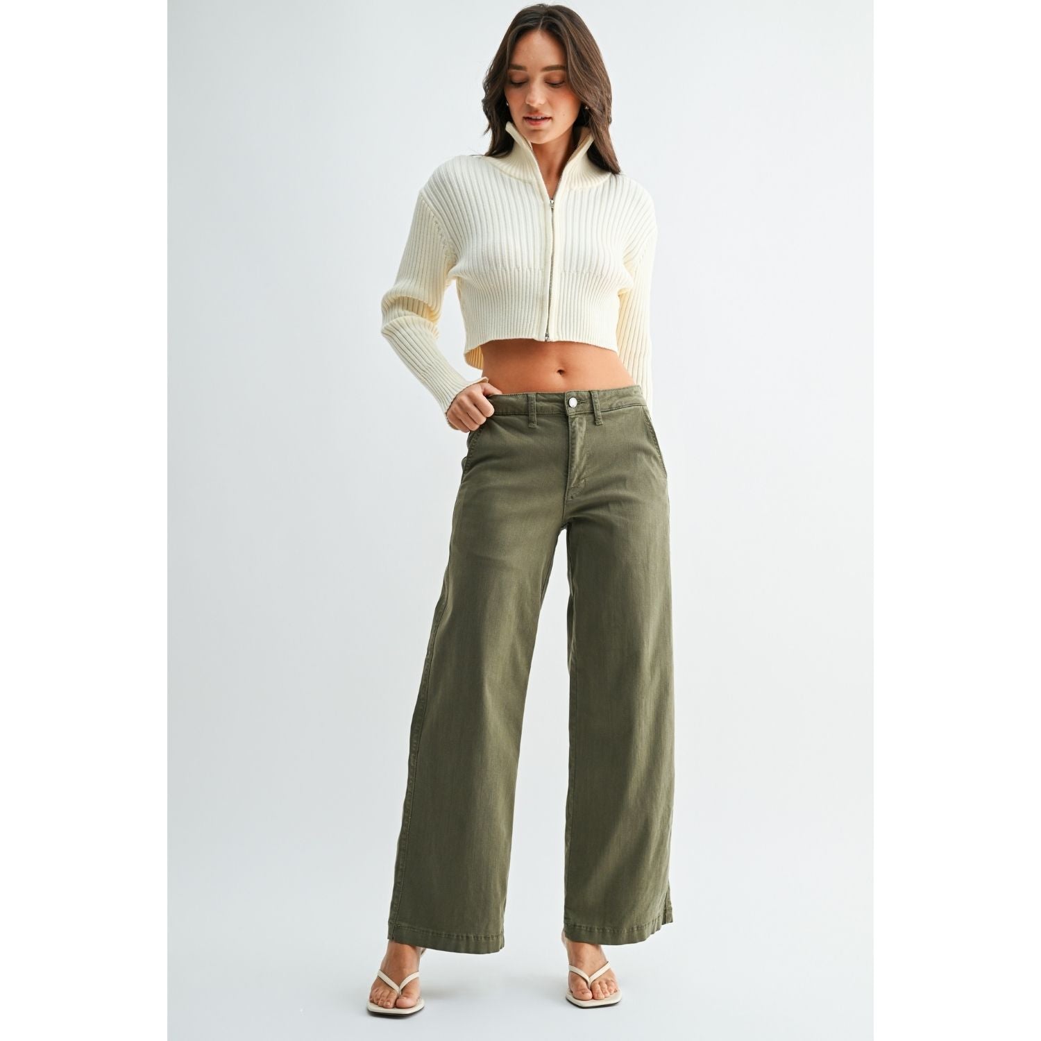Olive stretch twill pants with a slim wide-leg silhouette, button-front closure, and full-length hem.