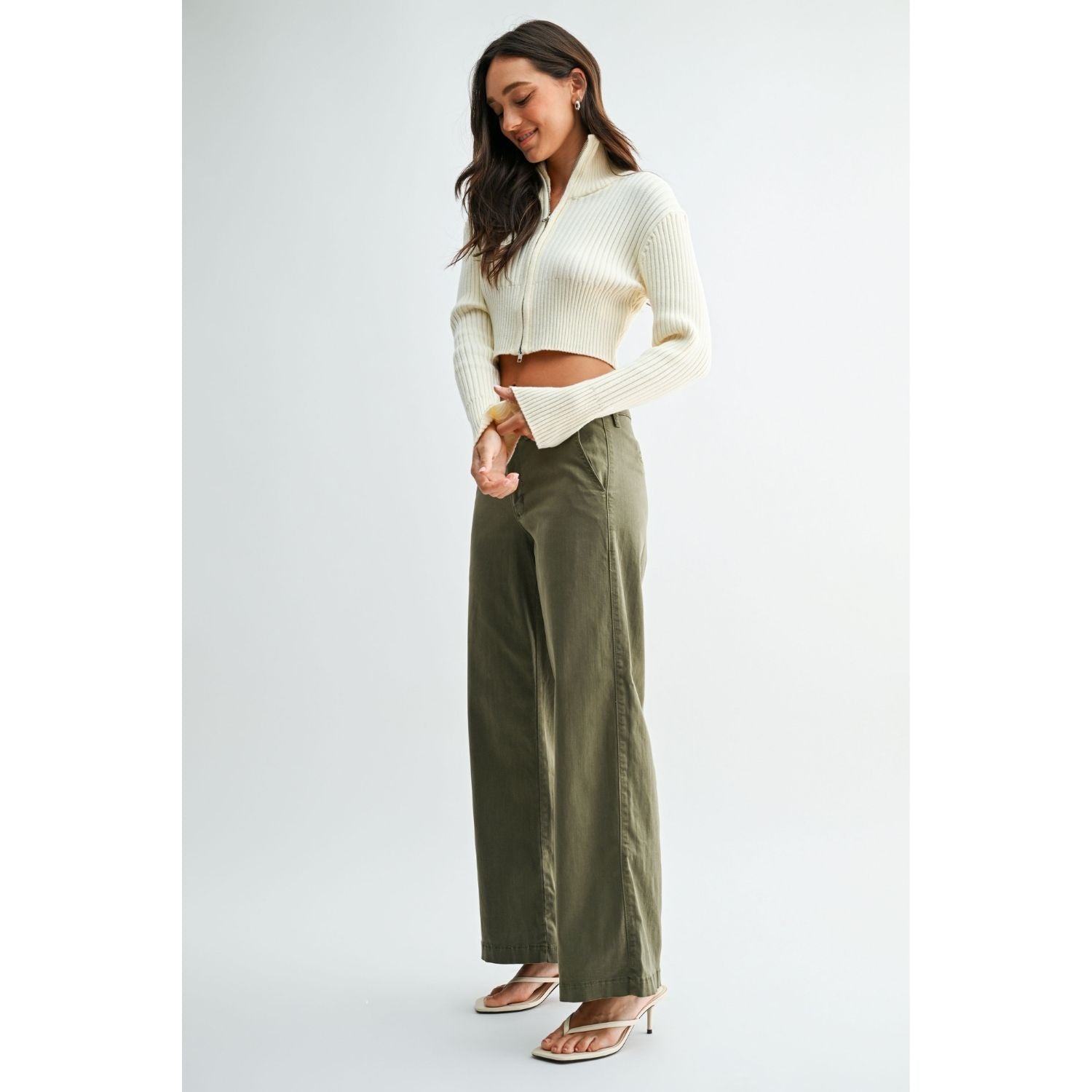 Olive stretch twill pants with a slim wide-leg silhouette, button-front closure, and full-length hem.