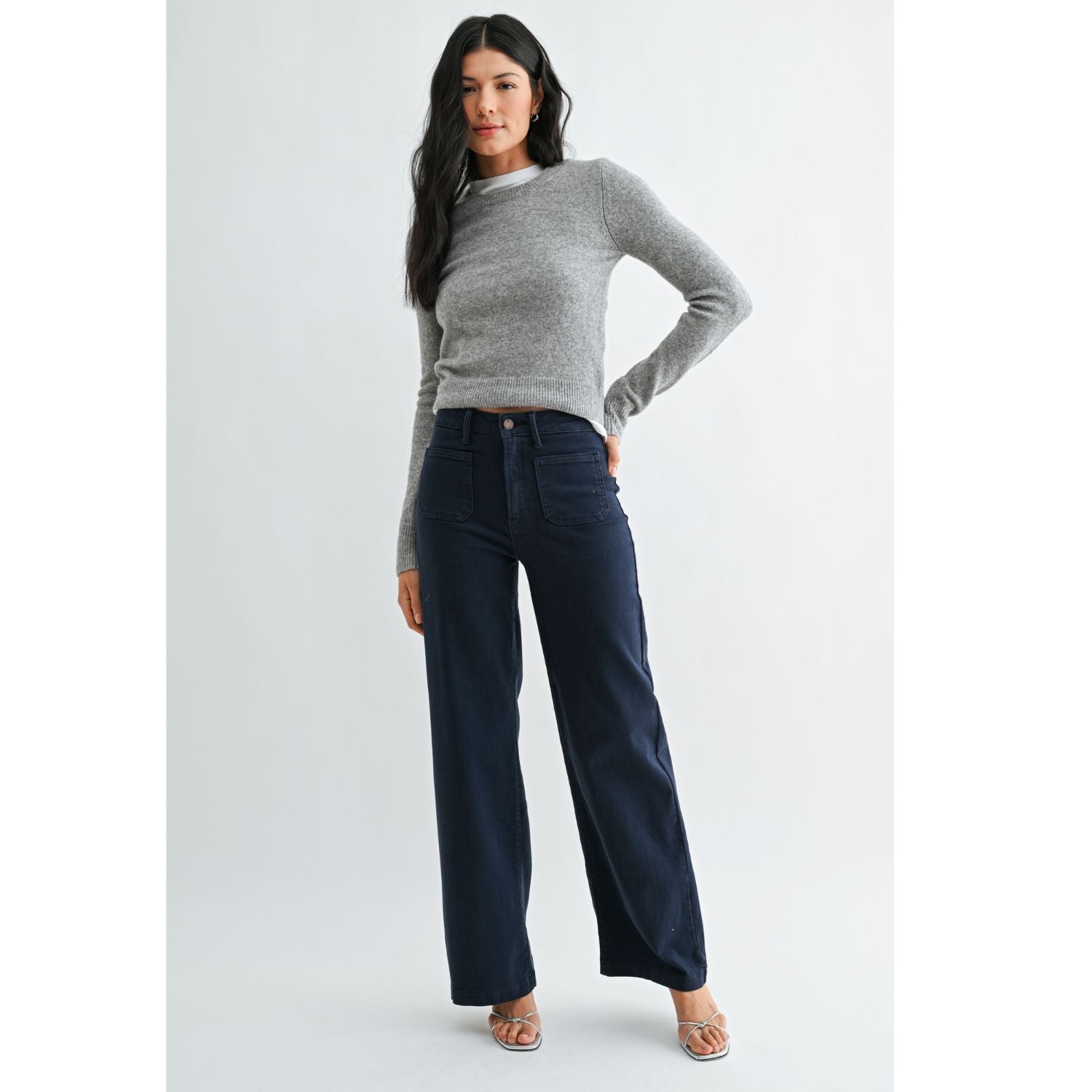 High-rise wide-leg jeans with statement front patch pockets and a relaxed denim silhouette.