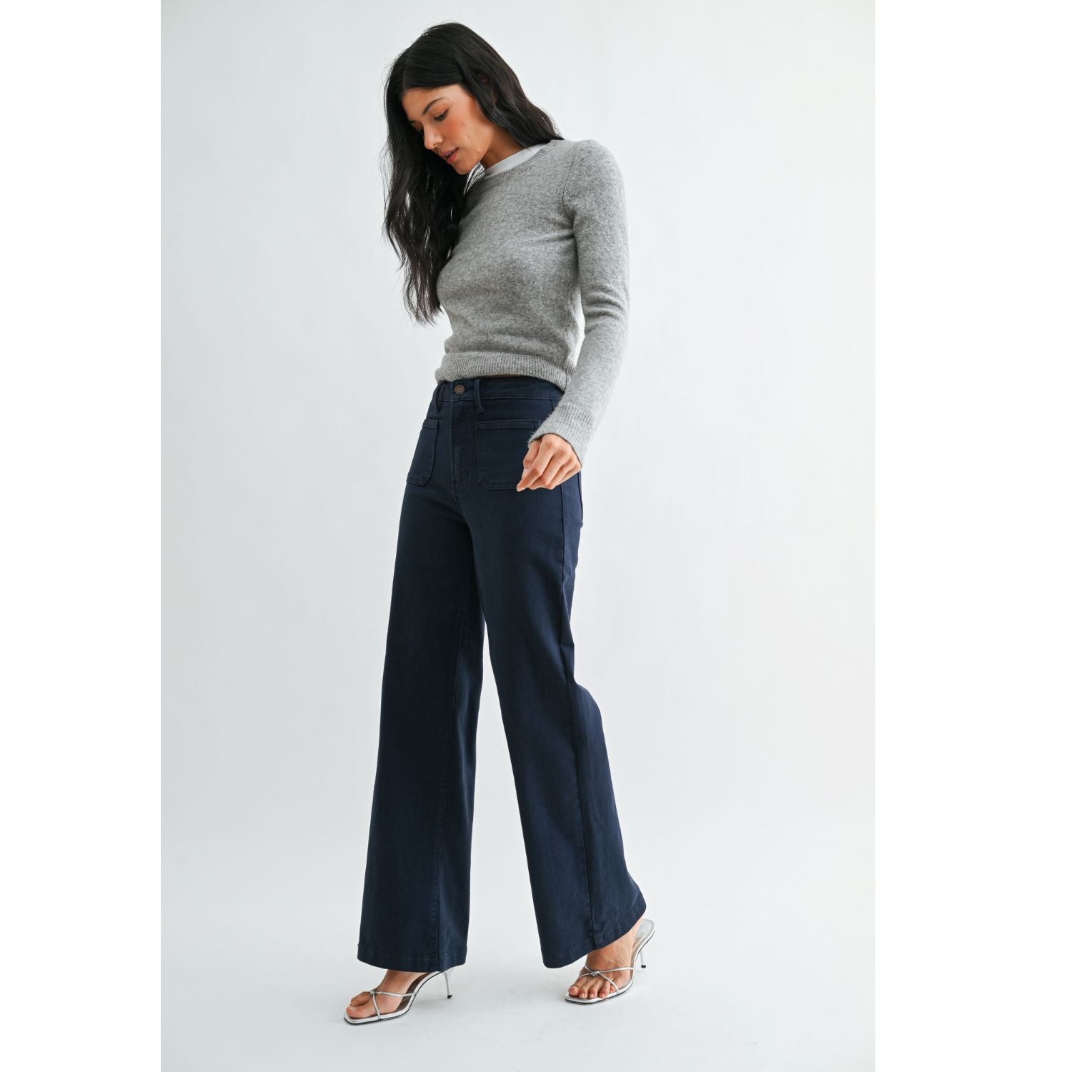 High-rise wide-leg jeans with statement front patch pockets and a relaxed denim silhouette.