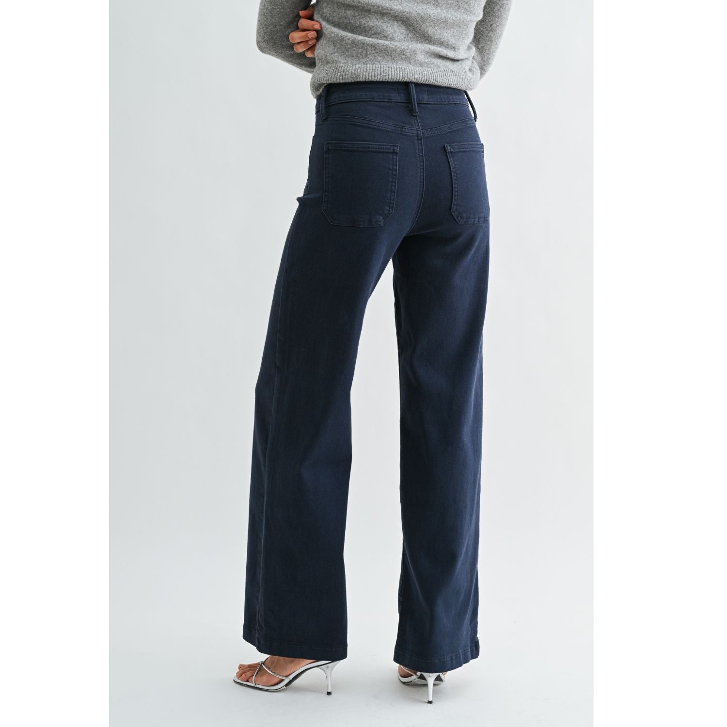 High-rise wide-leg jeans with statement front patch pockets and a relaxed denim silhouette.