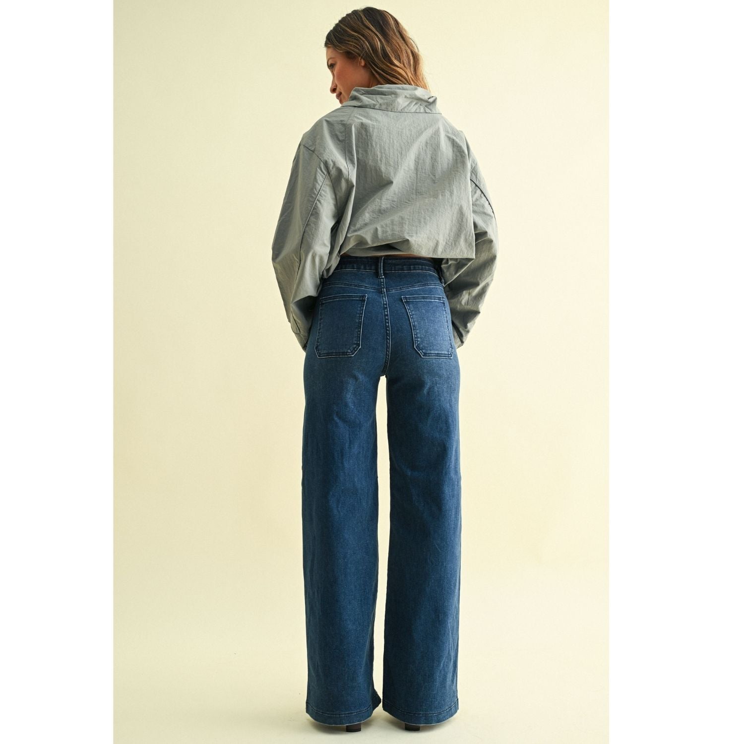 High-rise wide-leg jeans with statement front patch pockets and a relaxed denim silhouette.