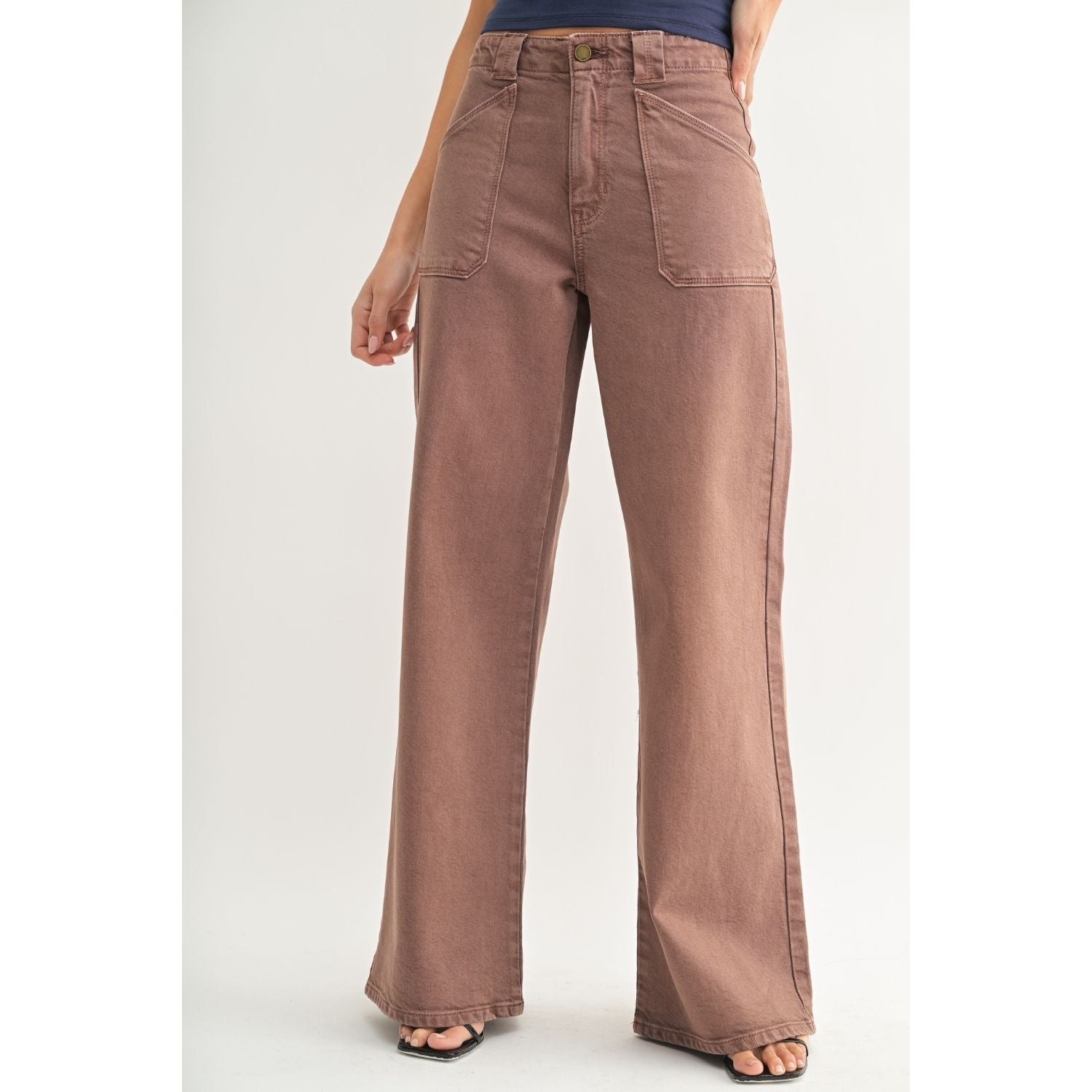 White high-rise wide-leg jeans with front patch pockets, welt back pockets, and silver hardware.