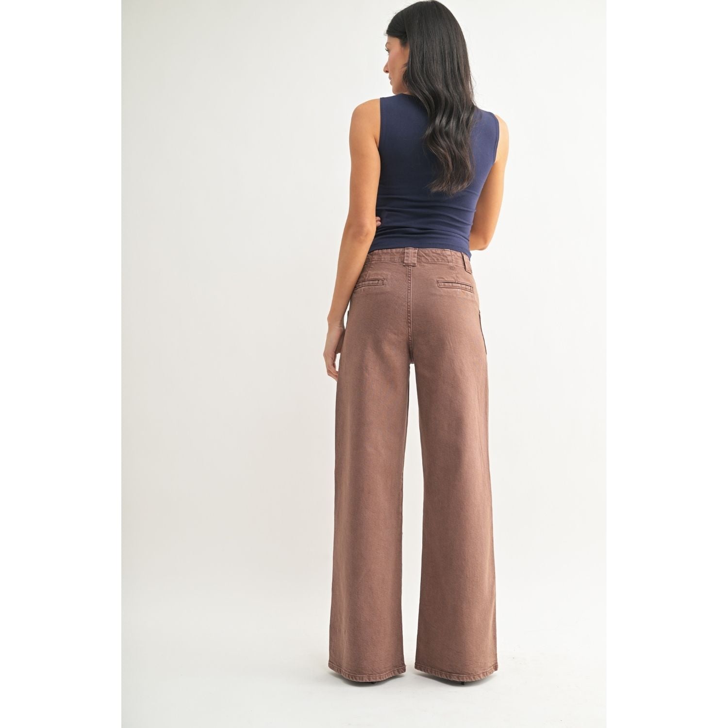 White high-rise wide-leg jeans with front patch pockets, welt back pockets, and silver hardware.