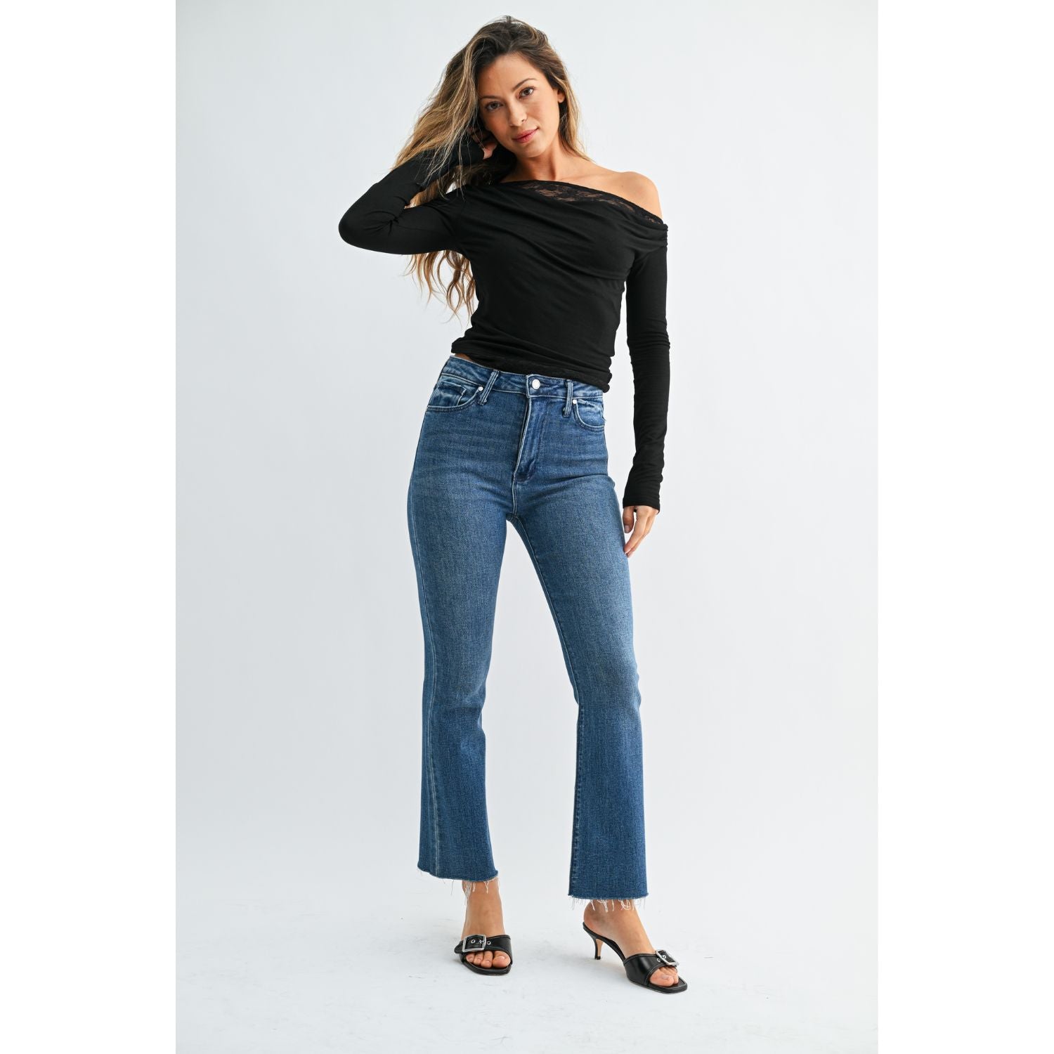 High-Rise Cropped Demi Flare Jeans feature a flattering slim fit through the hips and thighs, with a gently flared leg and cropped length for a modern, stylish silhouette.