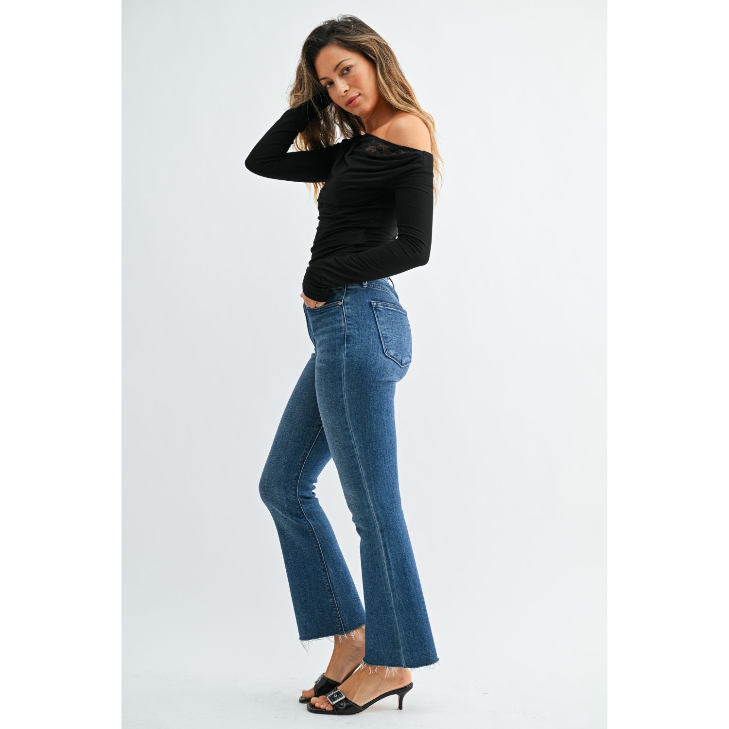 High-Rise Cropped Demi Flare Jeans feature a flattering slim fit through the hips and thighs, with a gently flared leg and cropped length for a modern, stylish silhouette.