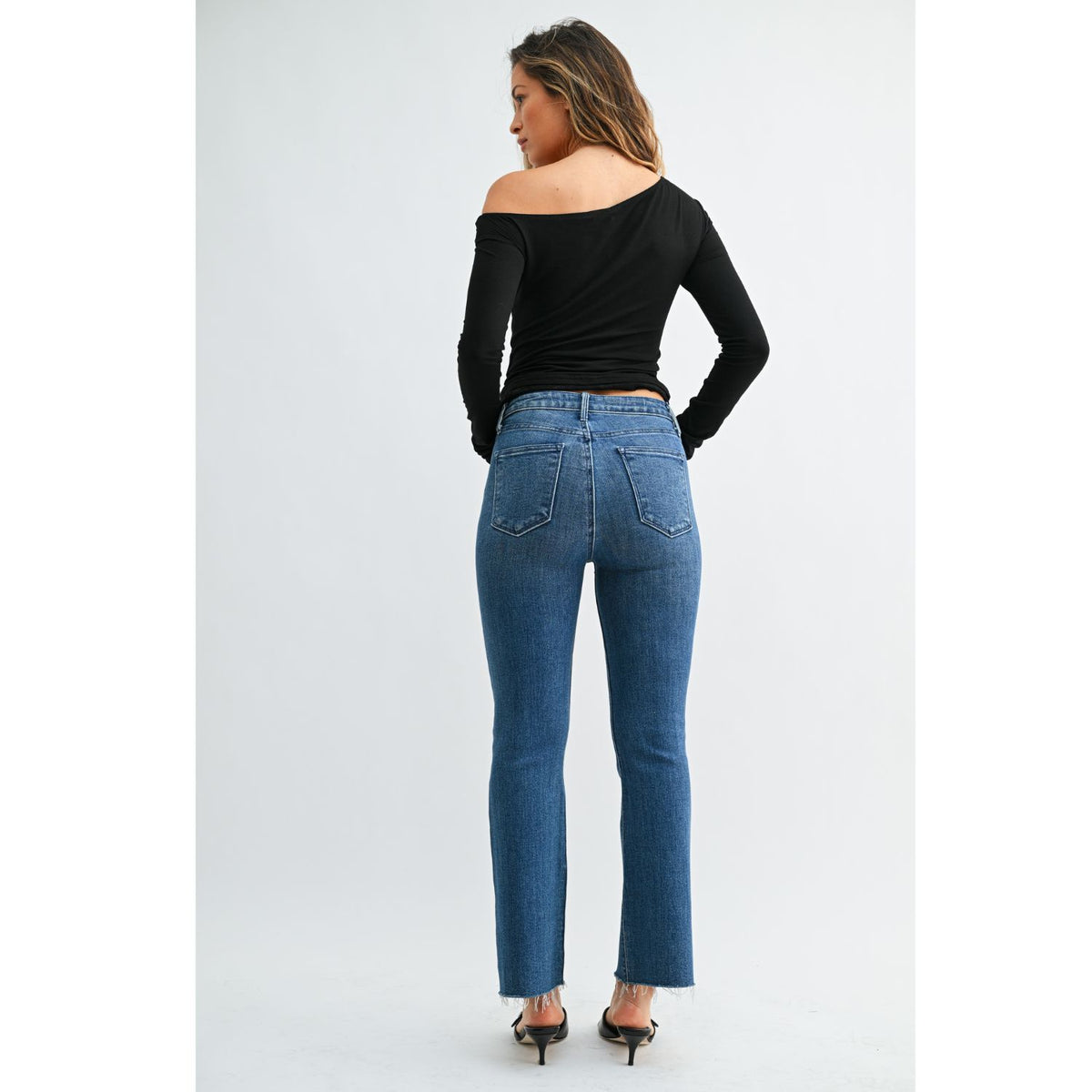 High-Rise Cropped Demi Flare Jeans feature a flattering slim fit through the hips and thighs, with a gently flared leg and cropped length for a modern, stylish silhouette.