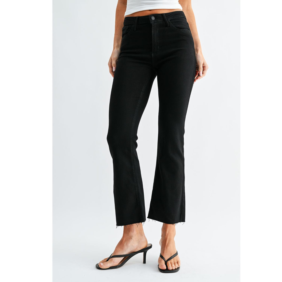 High-Rise Cropped Demi Flare Jeans feature a slim fit through the hips and thighs with a gently flared leg. The cropped silhouette and comfortable stretch offer a flattering, modern denim look