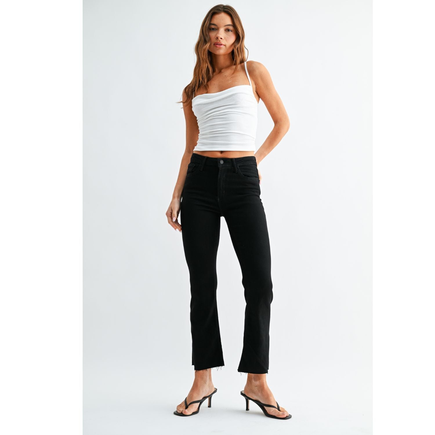 High-Rise Cropped Demi Flare Jeans feature a slim fit through the hips and thighs with a gently flared leg. The cropped silhouette and comfortable stretch offer a flattering, modern denim look