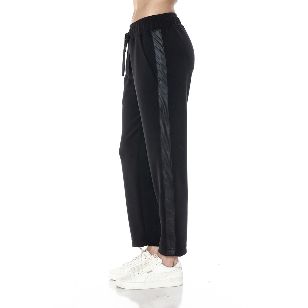 The Jass Straight Leg Pleather Pocket Sweatpants are the perfect mix of edgy and comfy. With sleek pleather pockets and a relaxed straight-leg fit, these sweatpants elevate your lounge game while keeping you cozy. Perfect for when you want to add a little attitude to your casual look without sacrificing comfort.