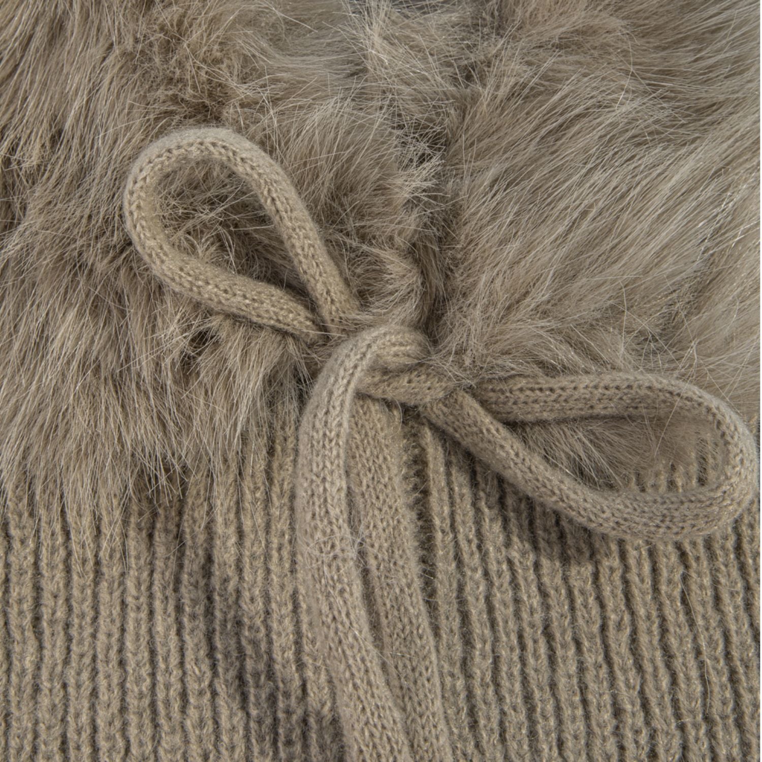 Knit balaclava with plush long-pile trim, ribbed shoulder cape, and tie neckline.