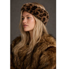 Leopard Faux Fur Headwrap in brown and black featuring a plush faux-fur texture, bold leopard print, and elegant twisted-front design for a stylish cold-weather look