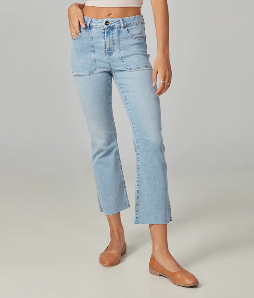 Billie is a high-rise boot jean that's cut to perfection, featuring a light was, True Denim, and complete with a cropped inseam and raw edge hem.