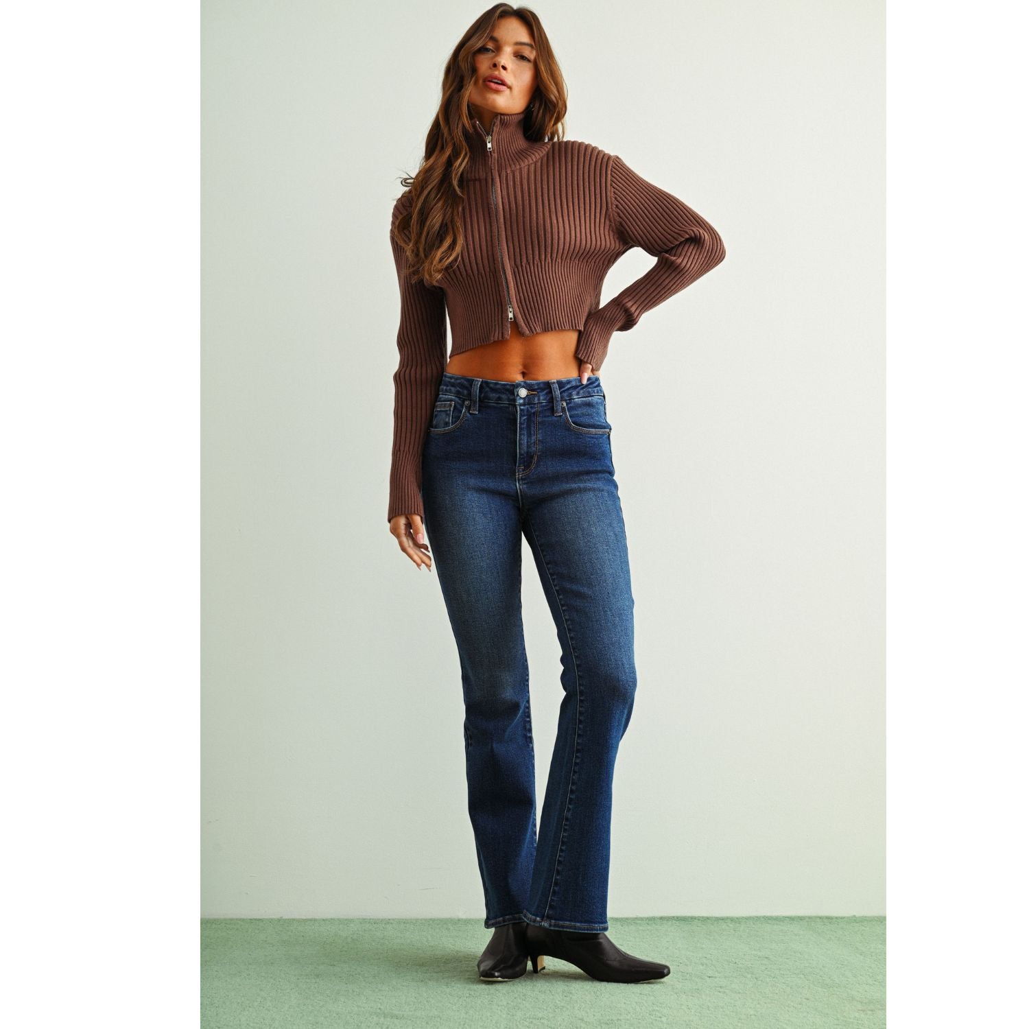 Mid-Rise Bootcut Jeans in a rich dark denim wash, featuring a flattering fit through the hips and thighs with a gently flared hem for a classic retro-inspired silhouette.