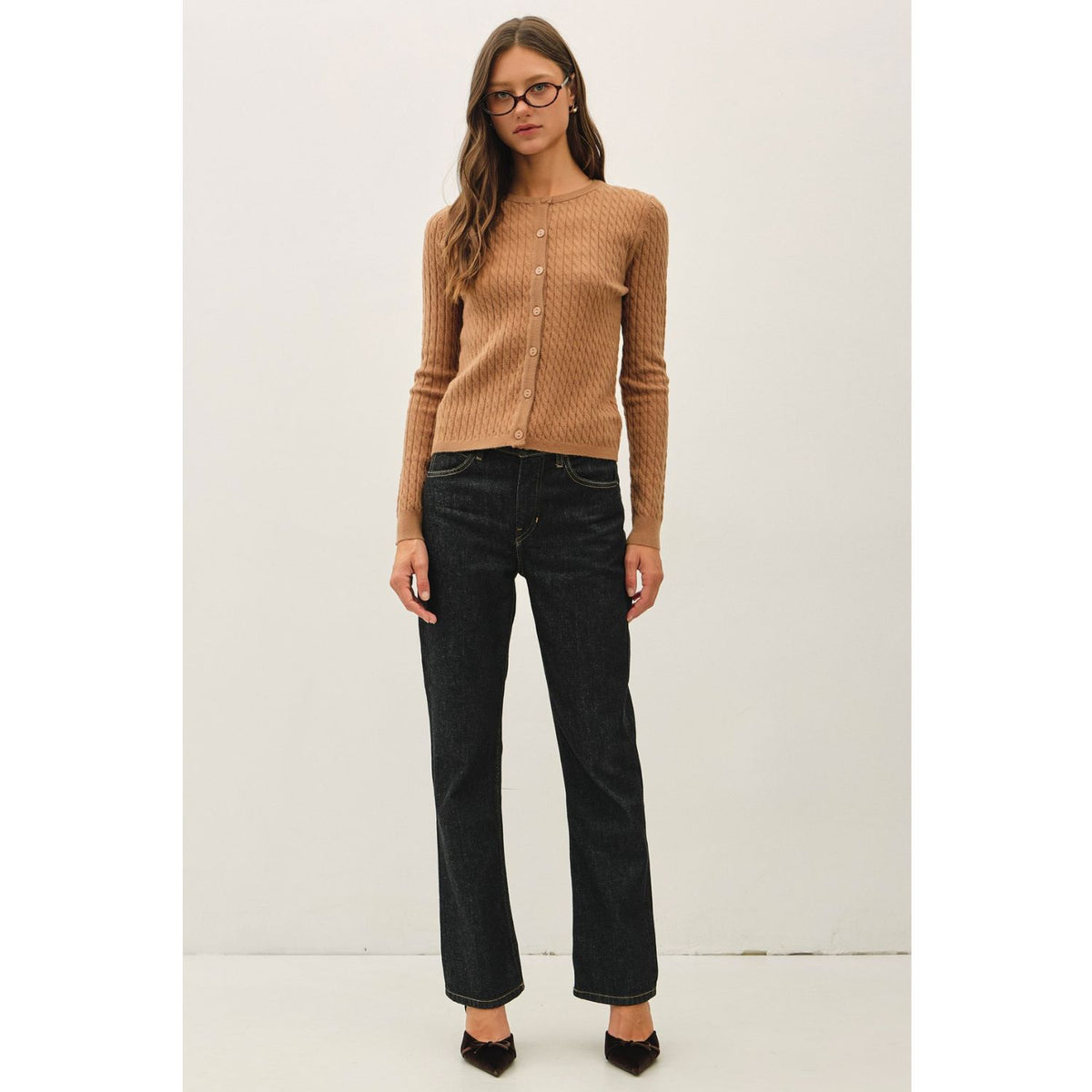 Women's fine cable knit cardigan with a crew neckline, button-up front, long sleeves, and slim-fit silhouette