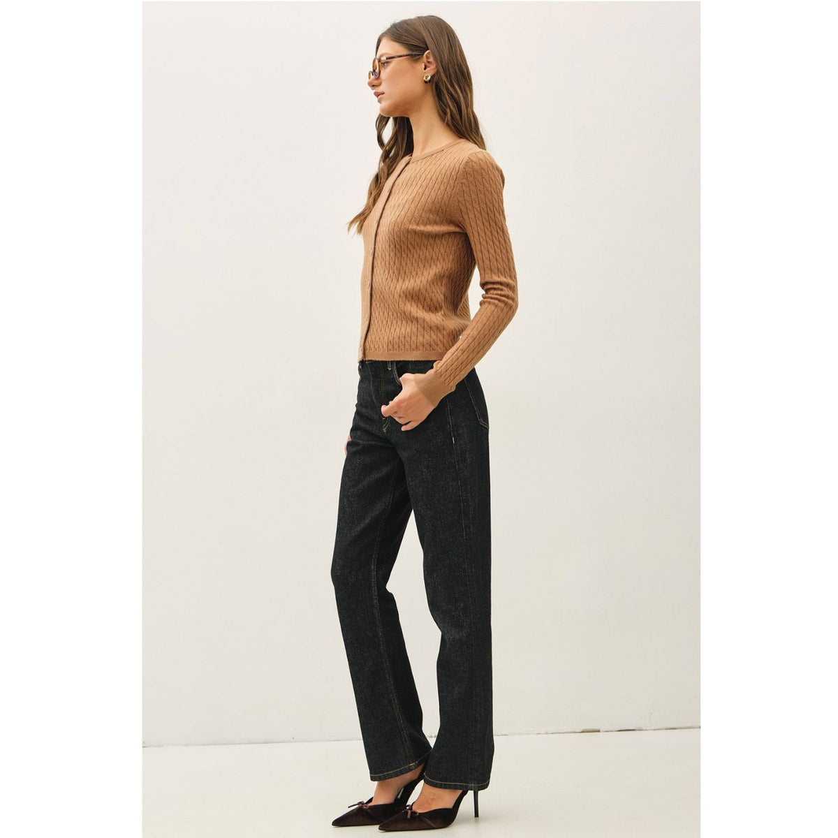 Women's fine cable knit cardigan with a crew neckline, button-up front, long sleeves, and slim-fit silhouette