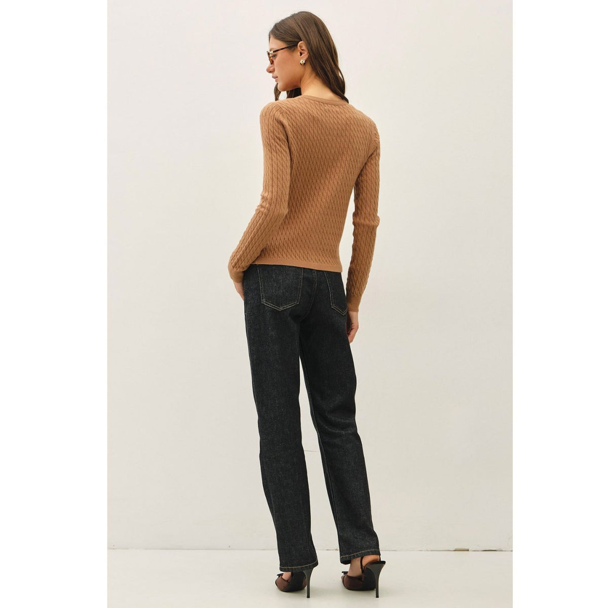 Women's fine cable knit cardigan with a crew neckline, button-up front, long sleeves, and slim-fit silhouette
