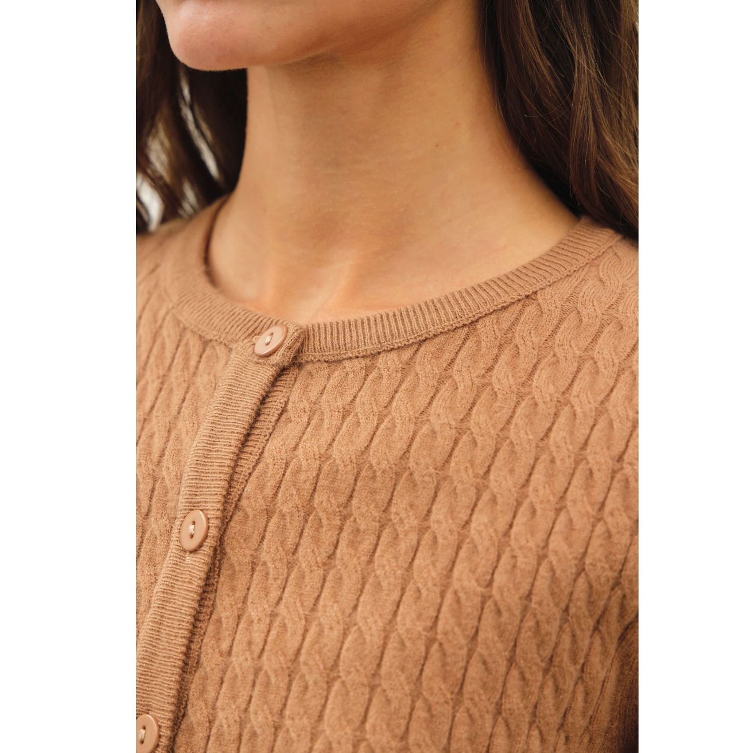 Women's fine cable knit cardigan with a crew neckline, button-up front, long sleeves, and slim-fit silhouette