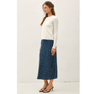 Women's fine cable knit cardigan with a crew neckline, button-up front, long sleeves, and slim-fit silhouette