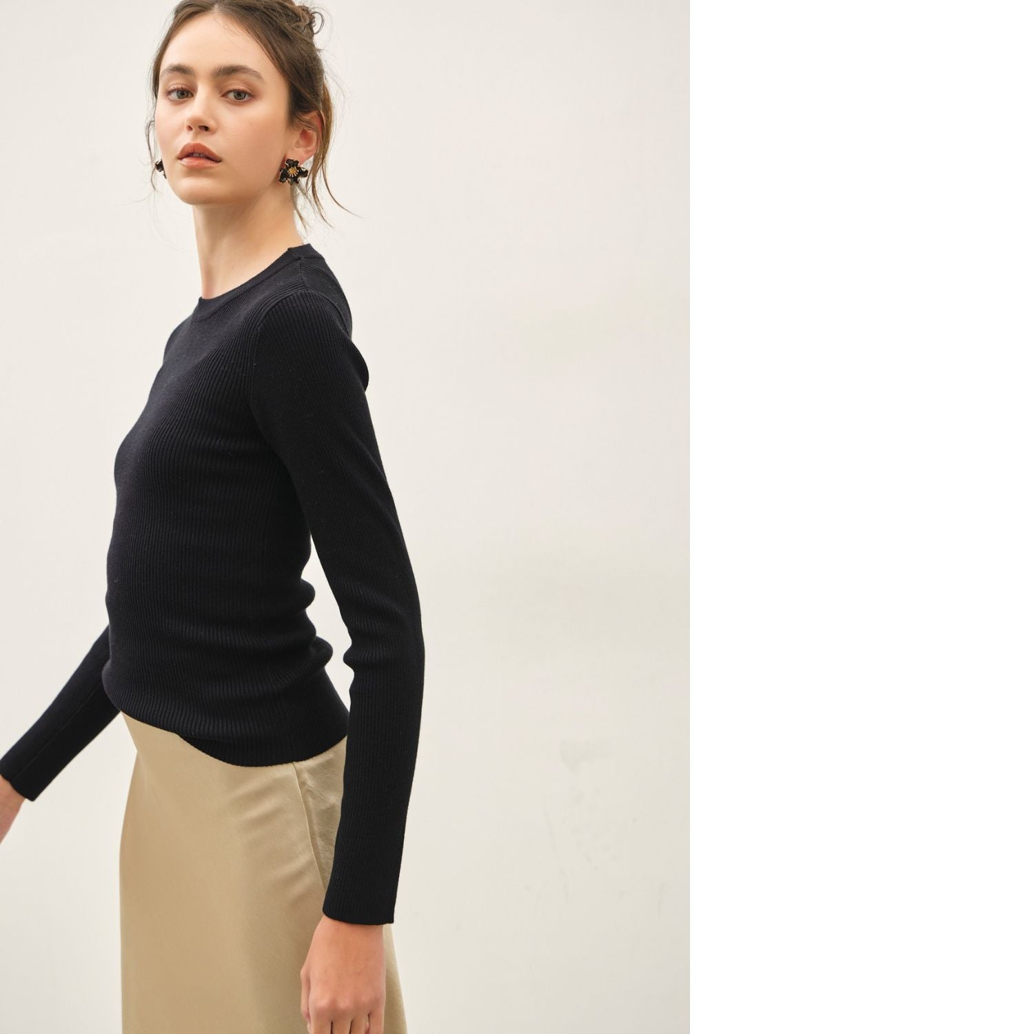 A classic rib-knit crewneck sweater featuring a soft viscose blend, comfortable stretch, long sleeves, and a fitted silhouette for everyday wear