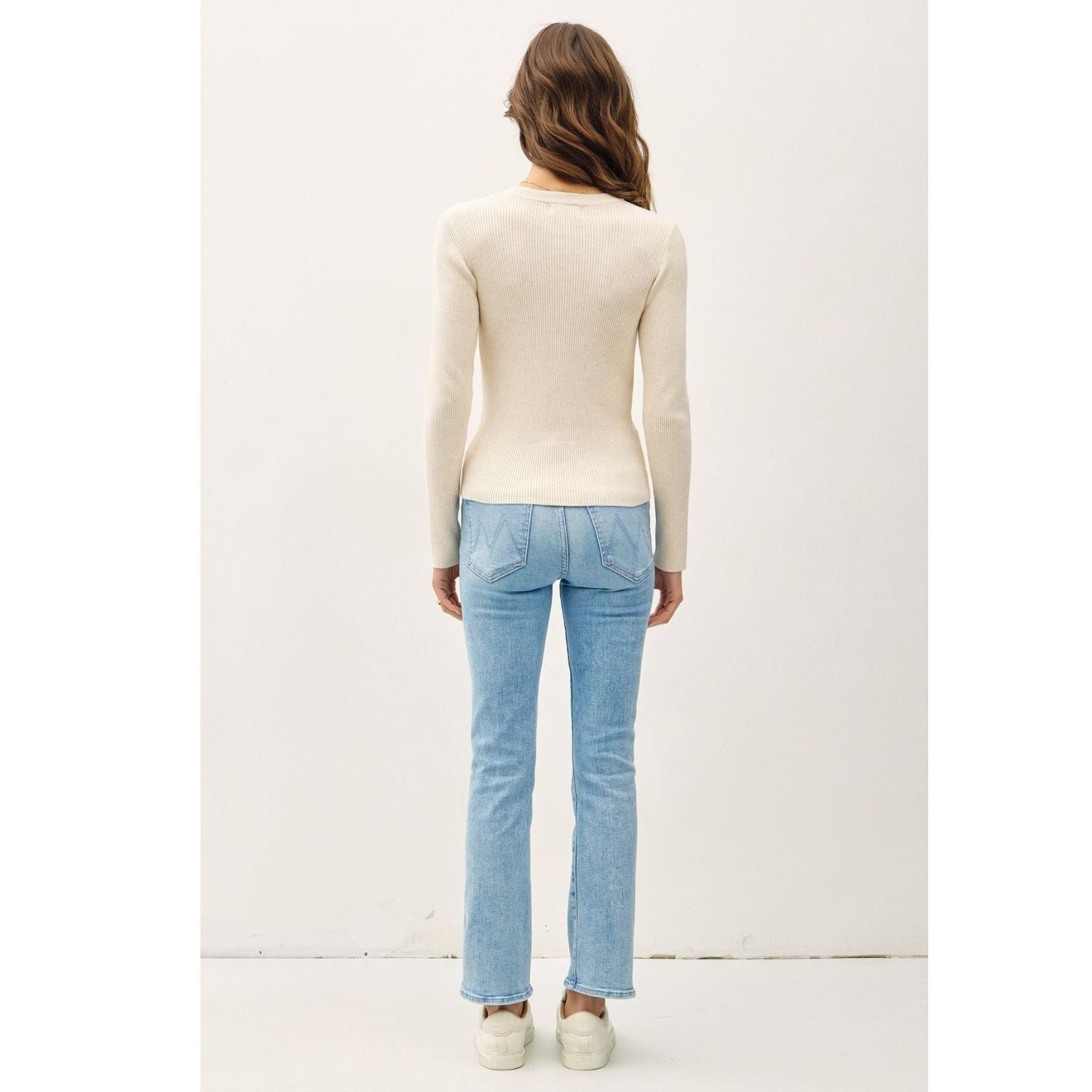 A classic rib-knit crewneck sweater featuring a soft viscose blend, comfortable stretch, long sleeves, and a fitted silhouette for everyday wear