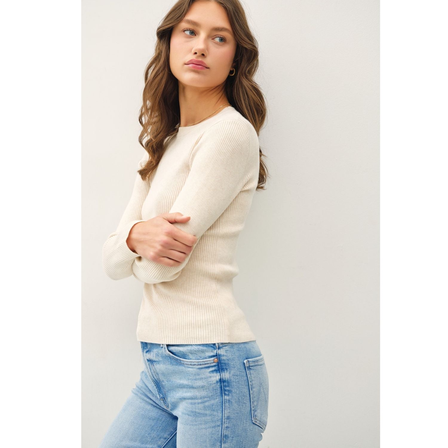 A classic rib-knit crewneck sweater featuring a soft viscose blend, comfortable stretch, long sleeves, and a fitted silhouette for everyday wear