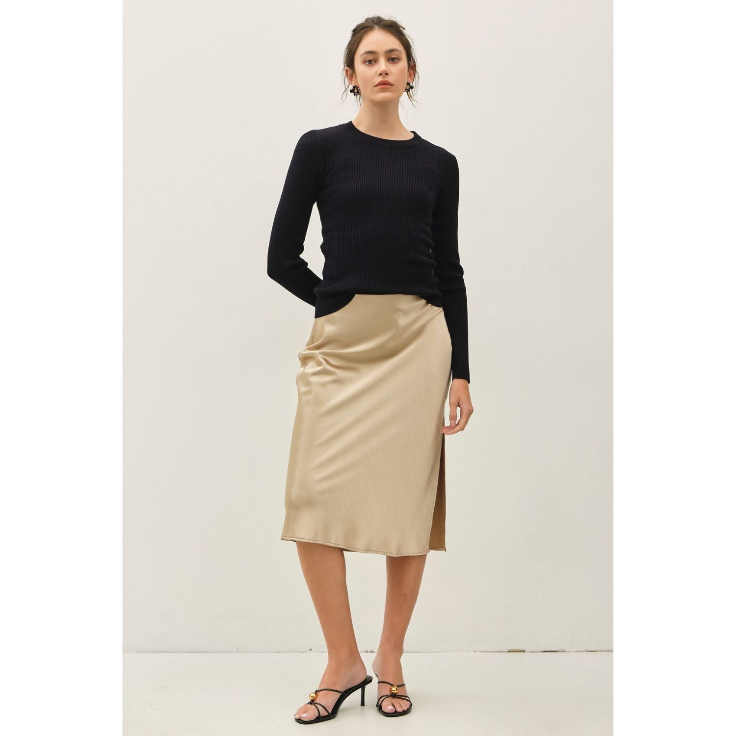A classic rib-knit crewneck sweater featuring a soft viscose blend, comfortable stretch, long sleeves, and a fitted silhouette for everyday wear