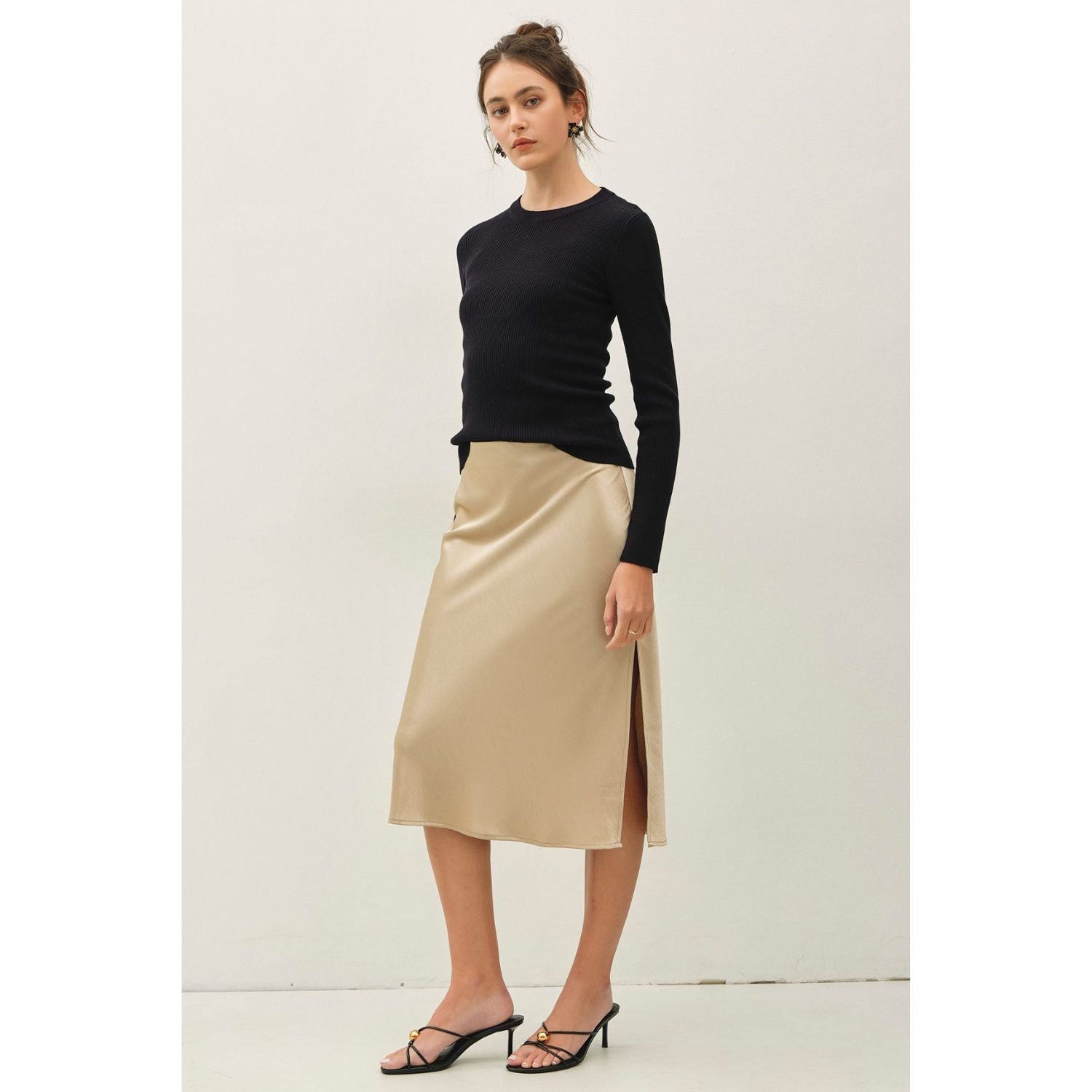A classic rib-knit crewneck sweater featuring a soft viscose blend, comfortable stretch, long sleeves, and a fitted silhouette for everyday wear