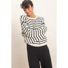 Model wearing Moonbeam Stripe Cozy Crewneck Sweater with black stripes, featuring a relaxed fit and ribbed trims