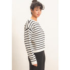 Model wearing Moonbeam Stripe Cozy Crewneck Sweater with black stripes, featuring a relaxed fit and ribbed trims