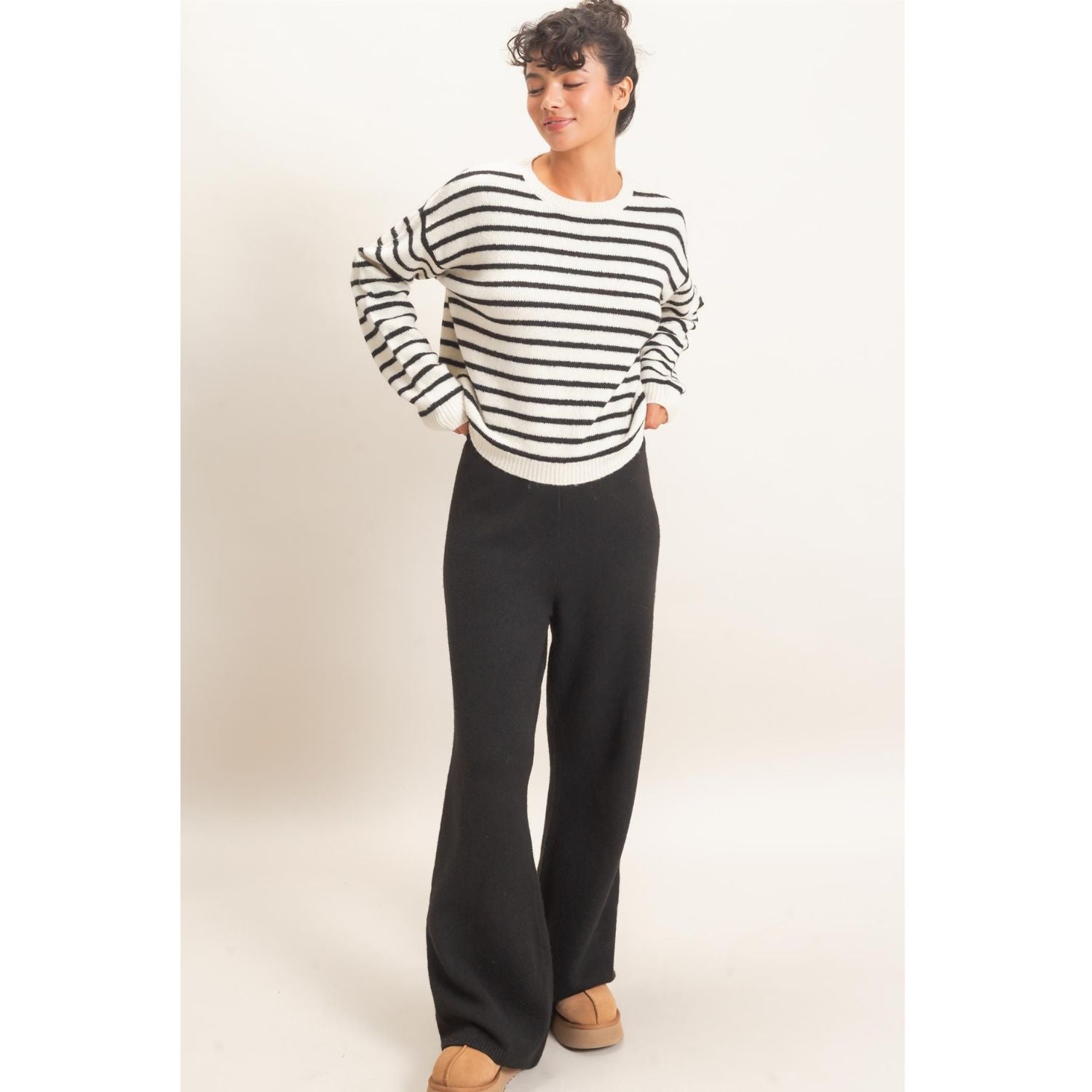 Model wearing Moonbeam Stripe Cozy Crewneck Sweater with black stripes, featuring a relaxed fit and ribbed trims