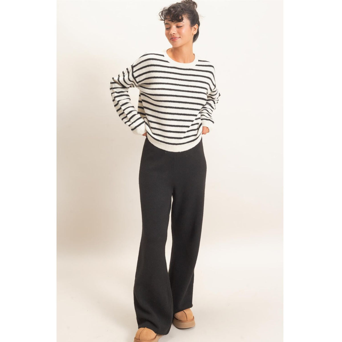 Model wearing Moonbeam Stripe Cozy Crewneck Sweater with black stripes, featuring a relaxed fit and ribbed trims