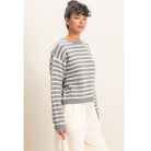 Model wearing Moonbeam Stripe Cozy Crewneck Sweater with black stripes, featuring a relaxed fit and ribbed trims