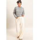 Model wearing Moonbeam Stripe Cozy Crewneck Sweater with black stripes, featuring a relaxed fit and ribbed trims