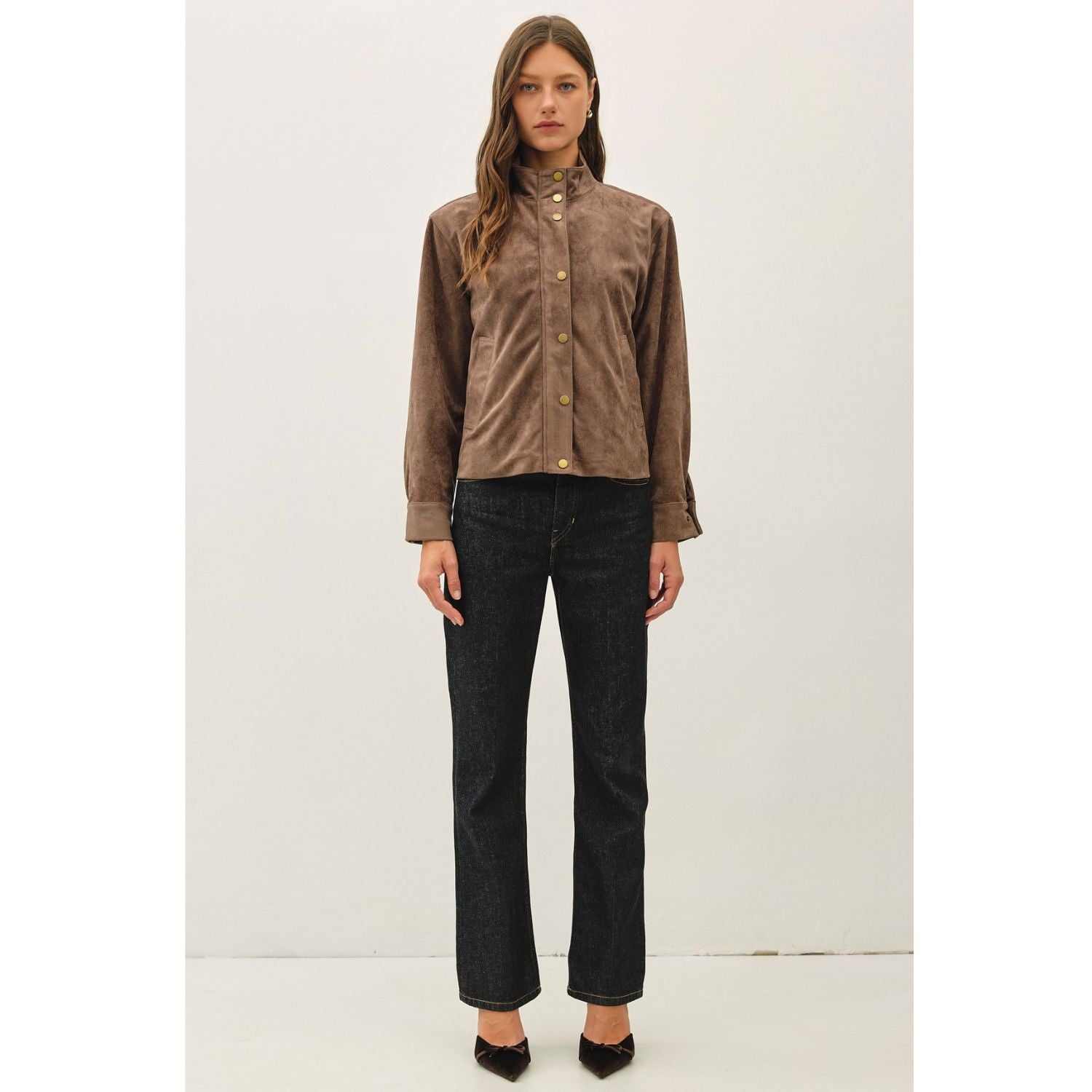 Women's suede-feel bomber jacket with a high collar, zipper and snap-button front, welt pockets, and banded hem