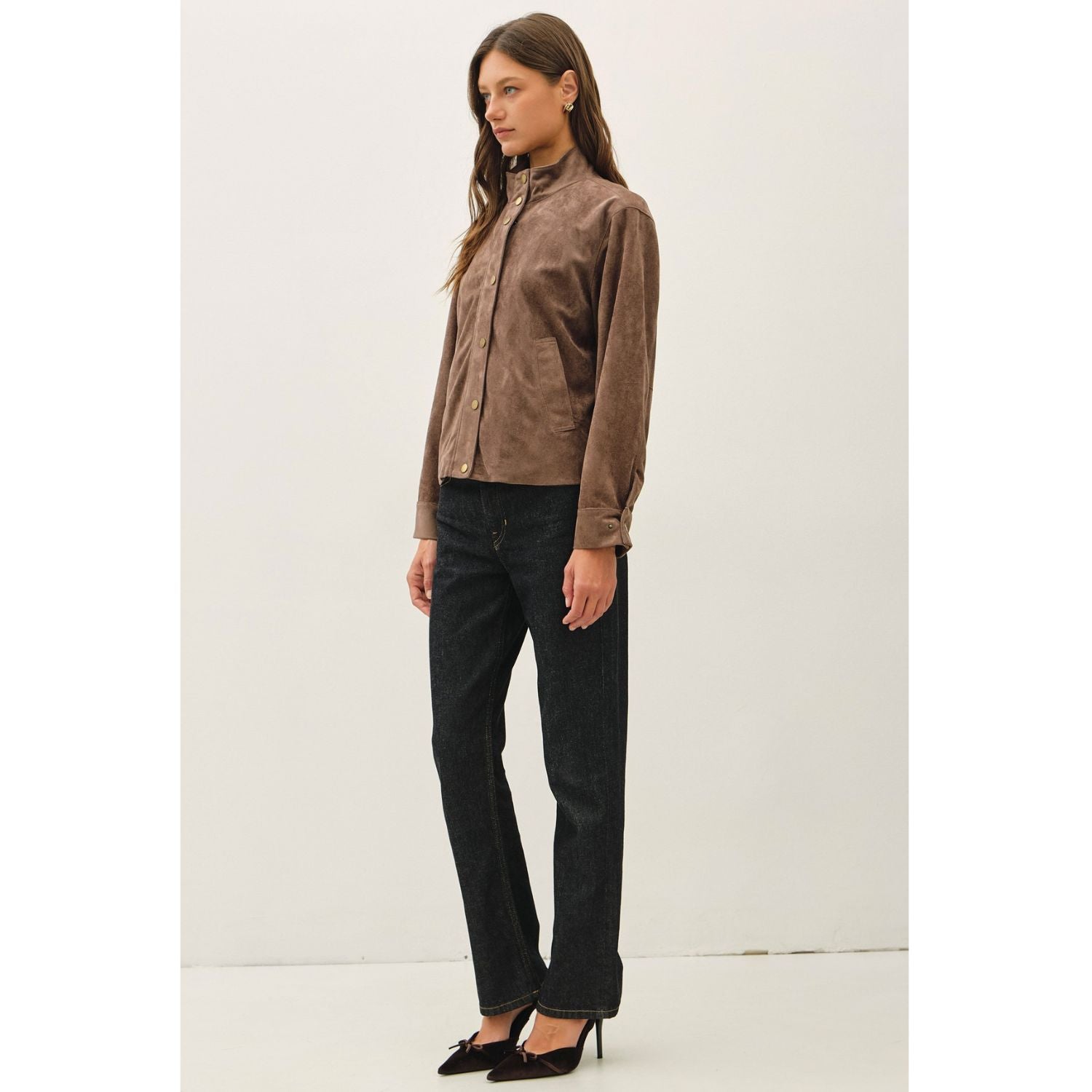 Women's suede-feel bomber jacket with a high collar, zipper and snap-button front, welt pockets, and banded hem