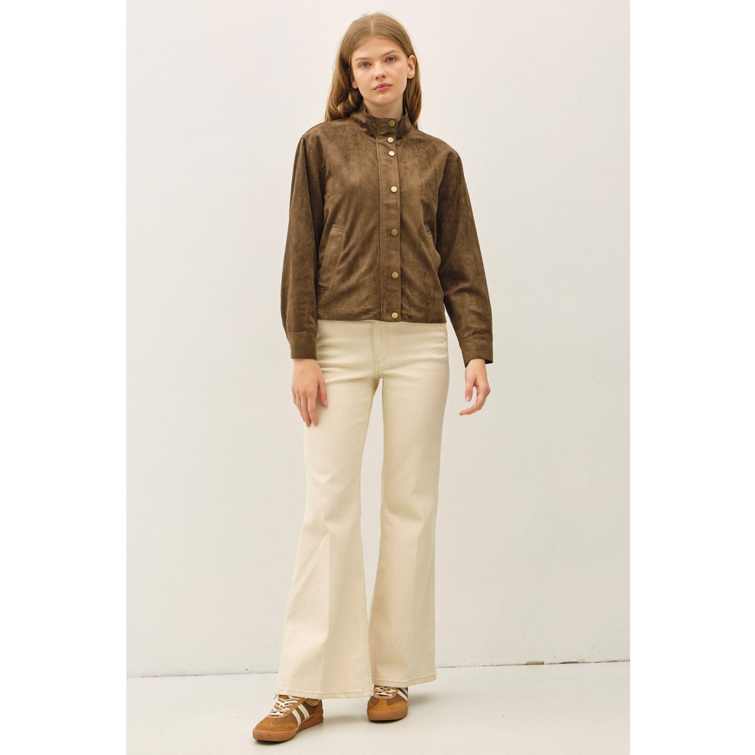 Women's suede-feel bomber jacket with a high collar, zipper and snap-button front, welt pockets, and banded hem