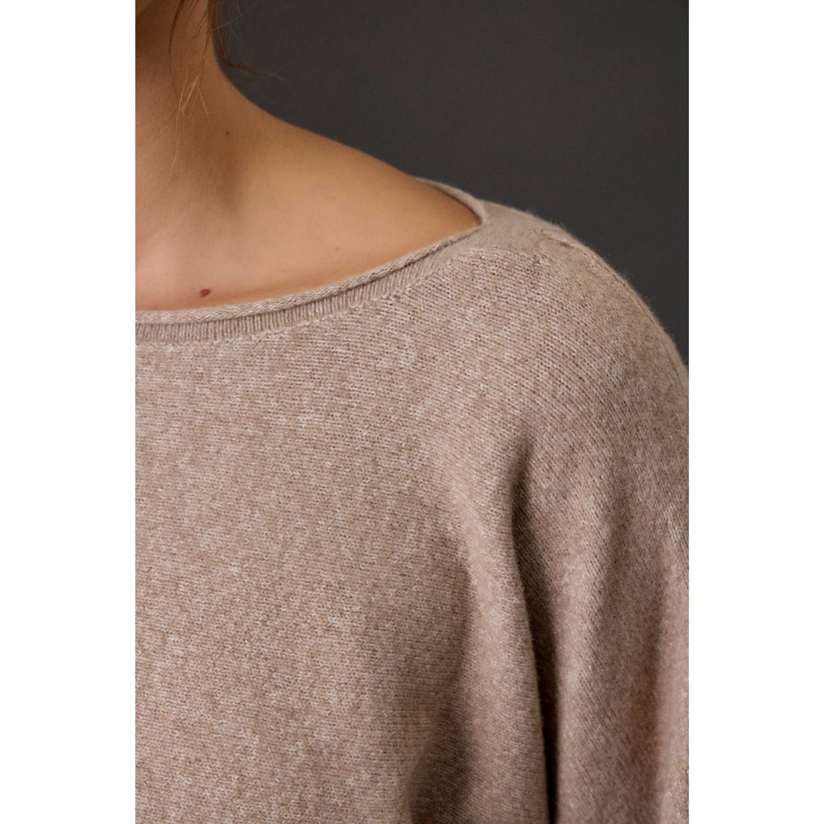 Women's heathered boat neck knit sweater with long sleeves, ribbed cuffs, rolled-edge details, and a relaxed fit