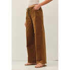 Women's wide-leg corduroy pants with a textured finish, elastic waistband, relaxed fit, and functional pockets