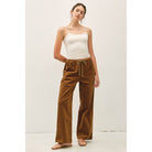 Women's wide-leg corduroy pants with a textured finish, elastic waistband, relaxed fit, and functional pockets