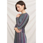Fitted multicolor striped ribbed knit top with metallic shimmer, split neckline, and long sleeves.