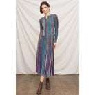 Fitted multicolor striped ribbed knit top with metallic shimmer, split neckline, and long sleeves.