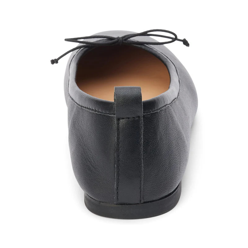Coconut by Matisse Nikki Ballet Flat Black. These classic ballet flats feature a soft leather design with a small bow detail and slip on style perfect for all day comfort when you're on the go.
