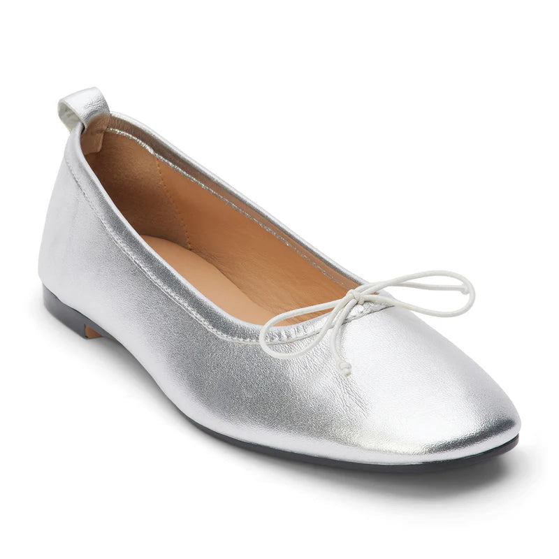 Coconut by Matisse Nikki Ballet Flat Silver. These classic ballet flats feature a soft leather design with a small bow detail and slip on style perfect for all day comfort when you're on the go.