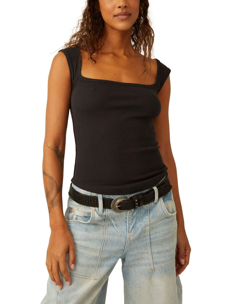 Free People Hummingbird Tee Black.Take your tops collection to the next level with this timeless tank featured in a staple ribbed knit fabrication with scoop neckline, rounded bottom hem, and defined seaming throughout for a true lived-in look.