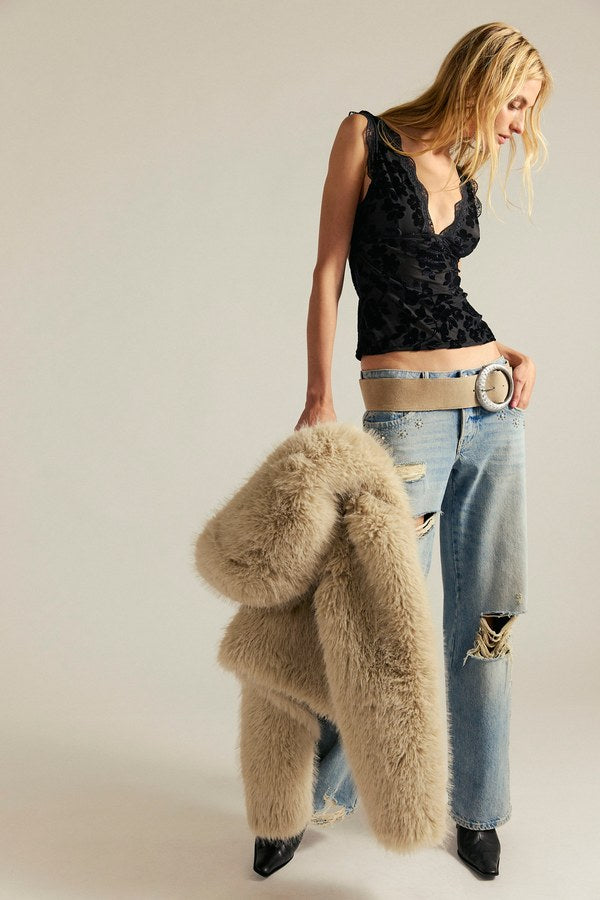 Free People Loved You First Velvet Lace in Black, full-length view styled with a fuzzy coat and jeans