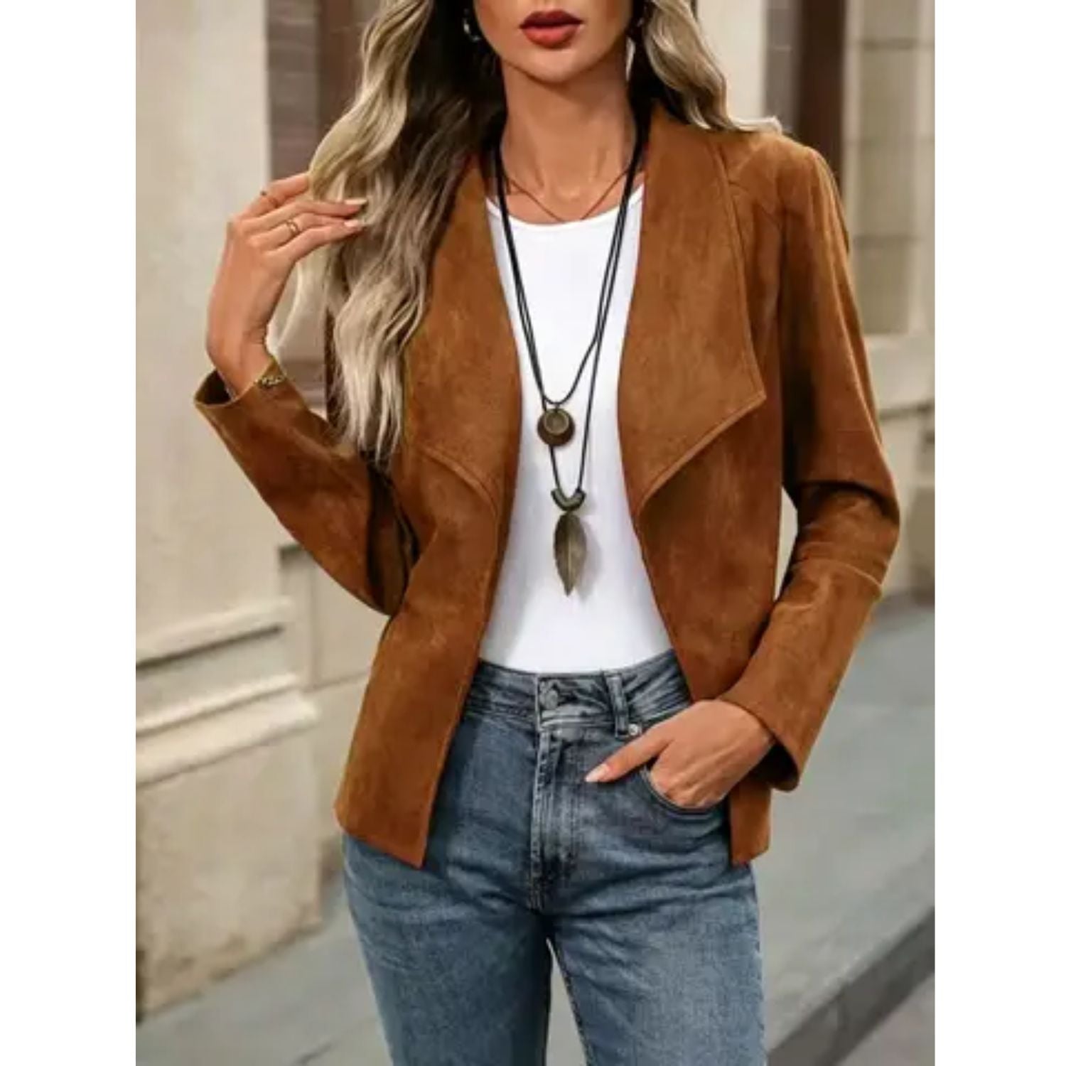Faux suede jacket with an open front, draped lapel, and long sleeves.